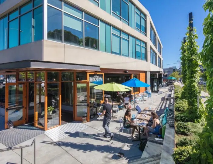 Outdoor eating at Brooks Sports Headquarters Building (Stone34). Image credit: LMN Architects