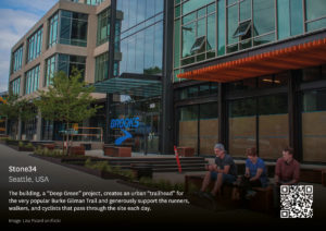 Poster of Stone34 in Seattle, USA. Image shows three people sitting on a bench with greenery nearby and a building in the background. Text reads 'The building, a "Deep Green" project, creates an urban "trailhead" for the very popular Burke Gilman Trail and generously supports the runners, walkers and cyclists that pass through the site each day'. Image by Lisa Picard on Flickr.